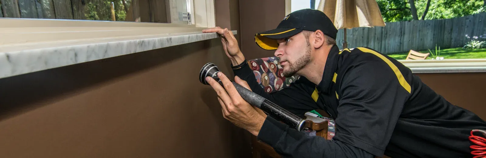 technician inspecting house