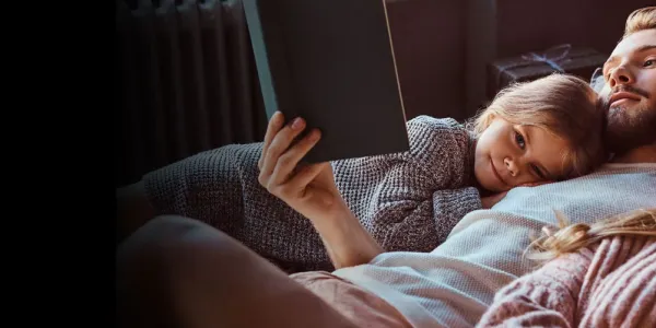 family-reading-in-bed