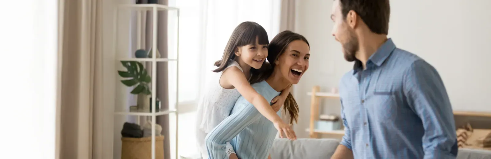 family laughing and playing in a pest free home
