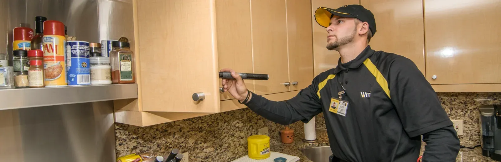 technician inspecting kitchen
